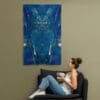 A woman sitting on the couch with her feet up.