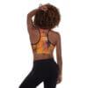 A woman is standing up wearing a sports bra