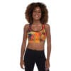 A woman wearing black pants and a sports bra.