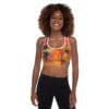 A woman wearing black pants and a sports bra.
