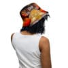 A person wearing a hat and white shirt