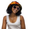 A woman wearing sunglasses and a hat.