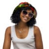 A woman wearing sunglasses and a colorful hat.