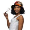 A woman holding glasses wearing a hat