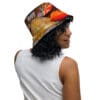 A woman wearing a hat with leaves on it.