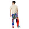 A man wearing colorful pants and a white shirt.