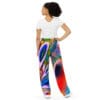 A woman wearing colorful pants and a white shirt.