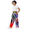 A woman wearing colorful pants and a white shirt