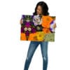 A woman holding up a picture of flowers.