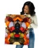 A woman holding up a picture of a colorful abstract design.