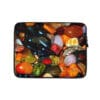 A laptop case with many different colored stones