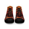 A pair of shoes with an orange and black plaid design.