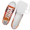 A pair of shoes with an orange and red pattern on them.