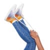 A person holding onto the laces of their shoes