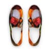 A pair of colorful sandals with red and yellow design.