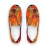 A pair of shoes with an orange and yellow design on them.