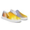 A pair of shoes with yellow and white designs on them.