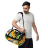 Man carrying vibrant colorful duffel bag.