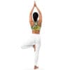 A woman in white pants and top doing yoga
