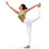 A woman in white pants and top doing yoga.