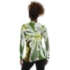 A woman wearing a green and white floral shirt.
