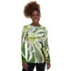 A woman wearing a long sleeve t-shirt with a picture of flowers.