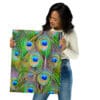 Woman holding vibrant peacock feather print.