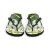 A pair of green flip flops with flowers on them.