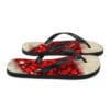 A pair of flip flops with red and white design.