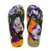 A pair of flip flops with flowers on them.