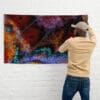 Vibrant butterfly wing tapestry on wall.