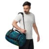 Man carrying a galaxy-print duffel bag.