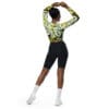 Woman in floral crop top and shorts.