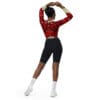 Woman in red top and black shorts.