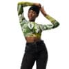 Woman in floral crop top and jeans.