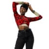 Woman in red crop top and jeans.