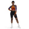 Woman in tie-dye top and black shorts.