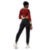 Woman in pomegranate print top and jeans.
