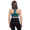 Woman in galaxy print sports bra and leggings.