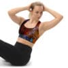 Woman in colorful sports bra doing sit-ups.