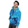 Man in blue galaxy hoodie smiling.