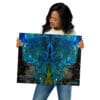 Woman holding vibrant blue nebula art.