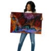 Woman holding vibrant butterfly wing art.