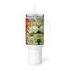 White mug with colorful flower design.
