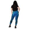 Woman wearing blue ocean leggings.