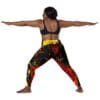Woman in yoga pose wearing patterned leggings.