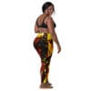 Woman in black top and colorful leggings.