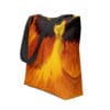 Orange flower tote bag with black straps.