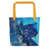 Blue crystal tote bag with orange straps.