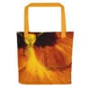 Orange pansy tote bag with yellow straps.